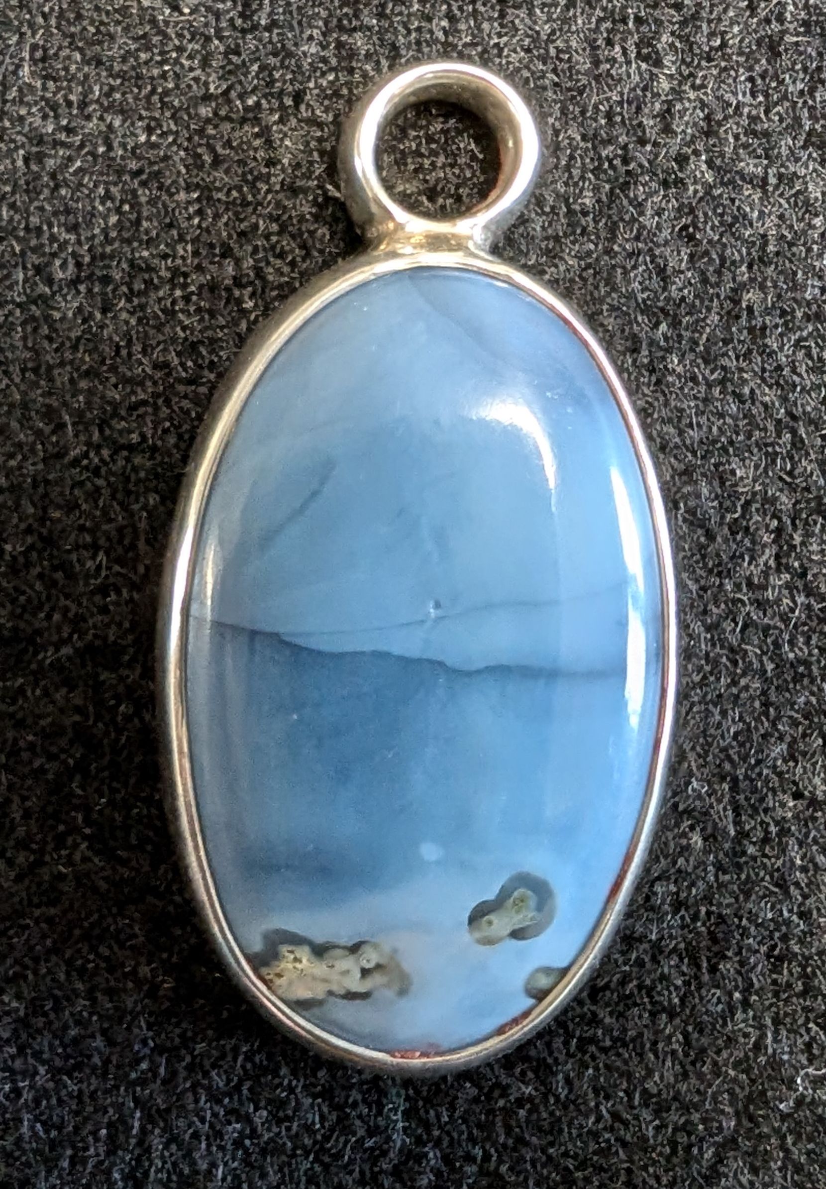 Blue Peruvian Opal & 925 Silver Pendant - Blue Peruvian Opal is a natural blue coloured type of opal known for it's calming, soothing energy that promotes balance. Surrounded with hand made .925 silver for it's brightness but with the more lasting durability for daily wear.
